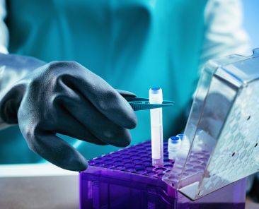 Biobanking. Technician preparing biological sample for deep freezing